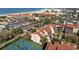 Breathtaking aerial view of a coastal complex complete with tennis courts and beach nearby at 6263 Midnight Pass Rd # 301, Sarasota, FL 34242