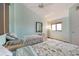 Inviting bedroom showcasing twin beds, complemented by a ceiling fan at 6263 Midnight Pass Rd # 301, Sarasota, FL 34242