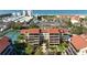 Exterior shot of a low-rise residential building near the beach and tennis courts at 6263 Midnight Pass Rd # 301, Sarasota, FL 34242