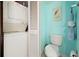 A laundry area featuring a stacked washer and dryer at 6263 Midnight Pass Rd # 301, Sarasota, FL 34242
