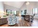 Living room featuring a high ceiling, a comfortable seating area, and a seamless transition to an adjoining sunroom at 6263 Midnight Pass Rd # 301, Sarasota, FL 34242