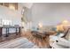 Bright living room featuring a spiral staircase, bar seating, comfortable sofas, and a large chandelier at 6263 Midnight Pass Rd # 301, Sarasota, FL 34242