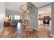 Open living space featuring a spiral staircase, seamlessly connecting to the living area and the kitchen at 6263 Midnight Pass Rd # 301, Sarasota, FL 34242