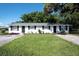 Charming duplex featuring a well-maintained lawn and landscaping, with updated windows and freshly painted exterior at 6434 5Th W St, Bradenton, FL 34207