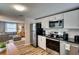 Clean kitchen featuring stainless steel appliances, granite countertops, and white cabinets at 6434 5Th W St, Bradenton, FL 34207