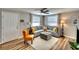 Inviting living room featuring neutral decor, comfortable seating, and a ceiling fan for added comfort at 6434 5Th W St, Bradenton, FL 34207