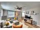 Bright and open living room featuring modern decor, wood-look floors, and a seamless flow into the dining area at 6434 5Th W St, Bradenton, FL 34207
