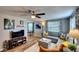 Comfortable living room with stylish decor, featuring a gray sectional and wood-look floors at 6434 5Th W St, Bradenton, FL 34207