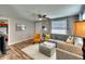 Cozy living room with stylish furniture, wood-look floors, and abundant natural light from the window at 6434 5Th W St, Bradenton, FL 34207