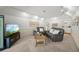 Bright living room featuring neutral colors, comfortable seating, and access to other areas of the home at 700 Tropical Cir, Sarasota, FL 34242