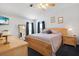 Inviting bedroom with a neutral color palette, wood furniture, and ample natural light at 709 Riverview Cir, North Port, FL 34287