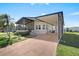 Charming home with a covered parking area and a cozy screened-in porch at 709 Riverview Cir, North Port, FL 34287