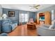 Inviting living room featuring wood floors, plenty of natural light, and comfortable seating area at 709 Riverview Cir, North Port, FL 34287