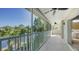 Peaceful screened-in balcony with views of the serene lake and surrounding trees at 7609 Sweetbay Cir # 7609, Bradenton, FL 34203