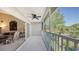 View of screened balcony with ceiling fan that is partially open to the living room, and outdoor area at 7609 Sweetbay Cir # 7609, Bradenton, FL 34203