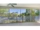 Screened-in balcony with views of the picturesque lake and lush landscaping at 7609 Sweetbay Cir # 7609, Bradenton, FL 34203