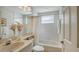 Bright, well-maintained bathroom with a shower-tub combo and a vanity with ample counter space at 7609 Sweetbay Cir # 7609, Bradenton, FL 34203