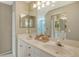 Bathroom with double sinks, large mirror, and lots of vanity storage at 7609 Sweetbay Cir # 7609, Bradenton, FL 34203