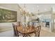 Bright dining area with an elegant chandelier and view of the kitchen at 7609 Sweetbay Cir # 7609, Bradenton, FL 34203