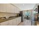 Modern kitchen with a breakfast nook and stainless steel appliances at 7609 Sweetbay Cir # 7609, Bradenton, FL 34203