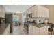 Charming kitchen featuring modern appliances, generous storage, and a cozy breakfast nook at 7609 Sweetbay Cir # 7609, Bradenton, FL 34203