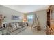 Comfortable living room with a plush sofa, patterned accent chair, and relaxing atmosphere at 7609 Sweetbay Cir # 7609, Bradenton, FL 34203