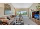 Cozy living room with a large sliding door to a private balcony at 7609 Sweetbay Cir # 7609, Bradenton, FL 34203