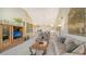 An open living room with high ceilings that offers ample space for relaxation and entertainment at 7609 Sweetbay Cir # 7609, Bradenton, FL 34203