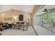Bright living room with seating, balcony access, and neutral carpet at 7609 Sweetbay Cir # 7609, Bradenton, FL 34203