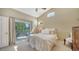 Bright main bedroom with high ceilings, ample natural light, and private balcony access at 7609 Sweetbay Cir # 7609, Bradenton, FL 34203
