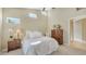 Comfortable main bedroom featuring neutral colors, high ceilings, and ample natural light at 7609 Sweetbay Cir # 7609, Bradenton, FL 34203
