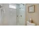 Bathroom features a clean glass shower with tiled walls and a classic framed art piece at 7609 Sweetbay Cir # 7609, Bradenton, FL 34203