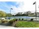 Well-maintained community tennis court with ample lighting and seating, perfect for a match at 7609 Sweetbay Cir # 7609, Bradenton, FL 34203