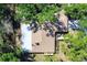 Aerial shot showcasing a well-maintained roof and spacious lot surrounded by trees, offering privacy at 8036 Conservatory Cir, Sarasota, FL 34243