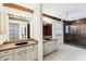 Dual view of bathroom featuring double sinks, a large mirror, and a glass-enclosed shower at 8036 Conservatory Cir, Sarasota, FL 34243