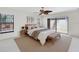 Well-lit bedroom with neutral tones, natural light, and a sliding glass door at 8036 Conservatory Cir, Sarasota, FL 34243