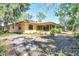 View of home exterior showcasing a spacious backyard, ideal for outdoor activities and relaxation at 8036 Conservatory Cir, Sarasota, FL 34243