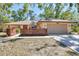 Charming one-story home featuring a two-car garage, wood fence, and a well-maintained lawn at 8036 Conservatory Cir, Sarasota, FL 34243