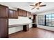Functional home office with custom cabinets, built-in desk, and a window for natural light at 8036 Conservatory Cir, Sarasota, FL 34243