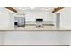 Kitchen boasts granite countertops, stainless steel appliances, and a bar with seating at 8036 Conservatory Cir, Sarasota, FL 34243