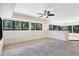 Open living area with large windows offering natural light and a view of the garden at 8036 Conservatory Cir, Sarasota, FL 34243