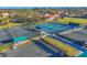 Active community features tennis and pickleball courts surrounded by lush landscaping and neighborhood views at 8036 Conservatory Cir, Sarasota, FL 34243
