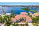 Amazing aerial view of home with private dock, waterway, marina and open bay access at 805 3Rd E St, Palmetto, FL 34221