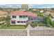 Elegant waterfront home featuring a screened pool, hot tub, and private boat dock at 805 3Rd E St, Palmetto, FL 34221