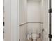 Cozy powder room with toilet, white walls, and dark trim at 805 3Rd E St, Palmetto, FL 34221