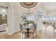 Elegant dining area offering a serene view of the screened-in pool and lanai at 805 3Rd E St, Palmetto, FL 34221