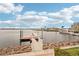Scenic dock view features a yacht, waterfront condos, and a clear sky at 805 3Rd E St, Palmetto, FL 34221