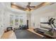 Exercise room with ceiling fan, lots of windows, and plenty of space for fitness equipment at 805 3Rd E St, Palmetto, FL 34221