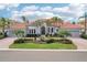 Lovely single-story home boasting lush landscaping, a three-car garage, and a welcoming entrance at 805 3Rd E St, Palmetto, FL 34221