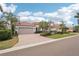 Charming single-story home featuring a brick driveway, well-manicured landscaping, and a two-car garage at 805 3Rd E St, Palmetto, FL 34221